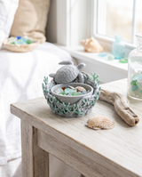 Sea turtle catchall bowl on a whitewashed console beside a seashell and driftwood