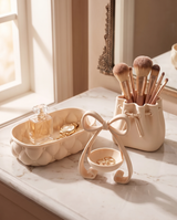 The Vanity Set styled together on a vanity with brushes, rings and perfume