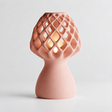 Glow Petal table lamp in Blush Pink with light puck illuminated