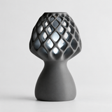 Glow Petal table lamp in Charcoal with light puck illuminated