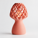 Glow Petal table lamp in Coral with light puck illuminated