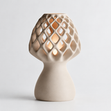 Glow Petal table lamp in Cream with light puck illuminated