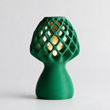 Glow Petal table lamp in Forest Green with light puck illuminated
