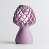 Glow Petal table lamp in Lilac with light puck illuminated