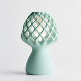 Glow Petal table lamp in Mint with light puck illuminated