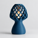 Glow Petal table lamp in Ocean Blue with light puck illuminated