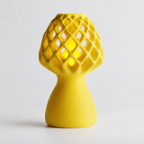 Glow Petal table lamp in Yellow with light puck illuminated